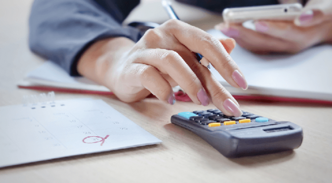 Woman Calculating Tax